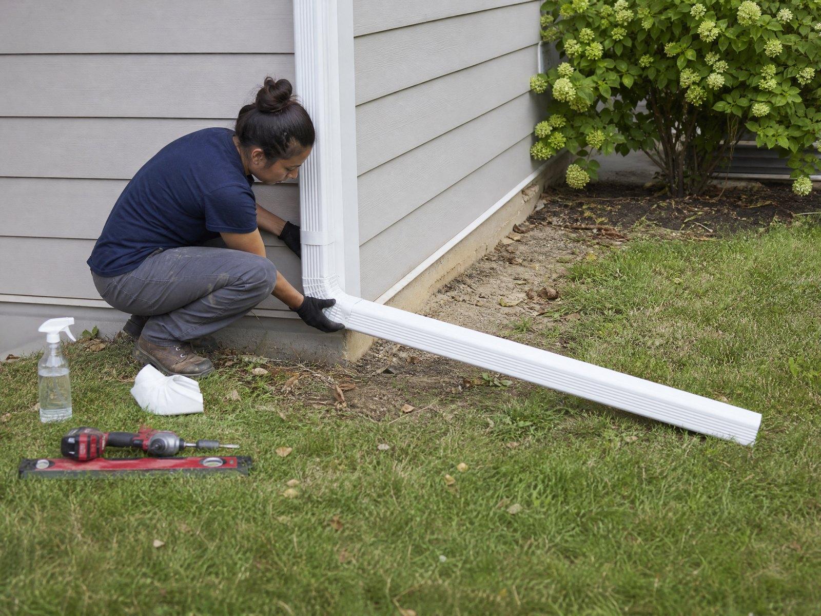 Fitting a downspout and extension